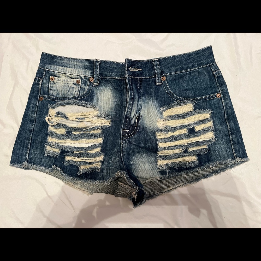 Distressed denim shorts.